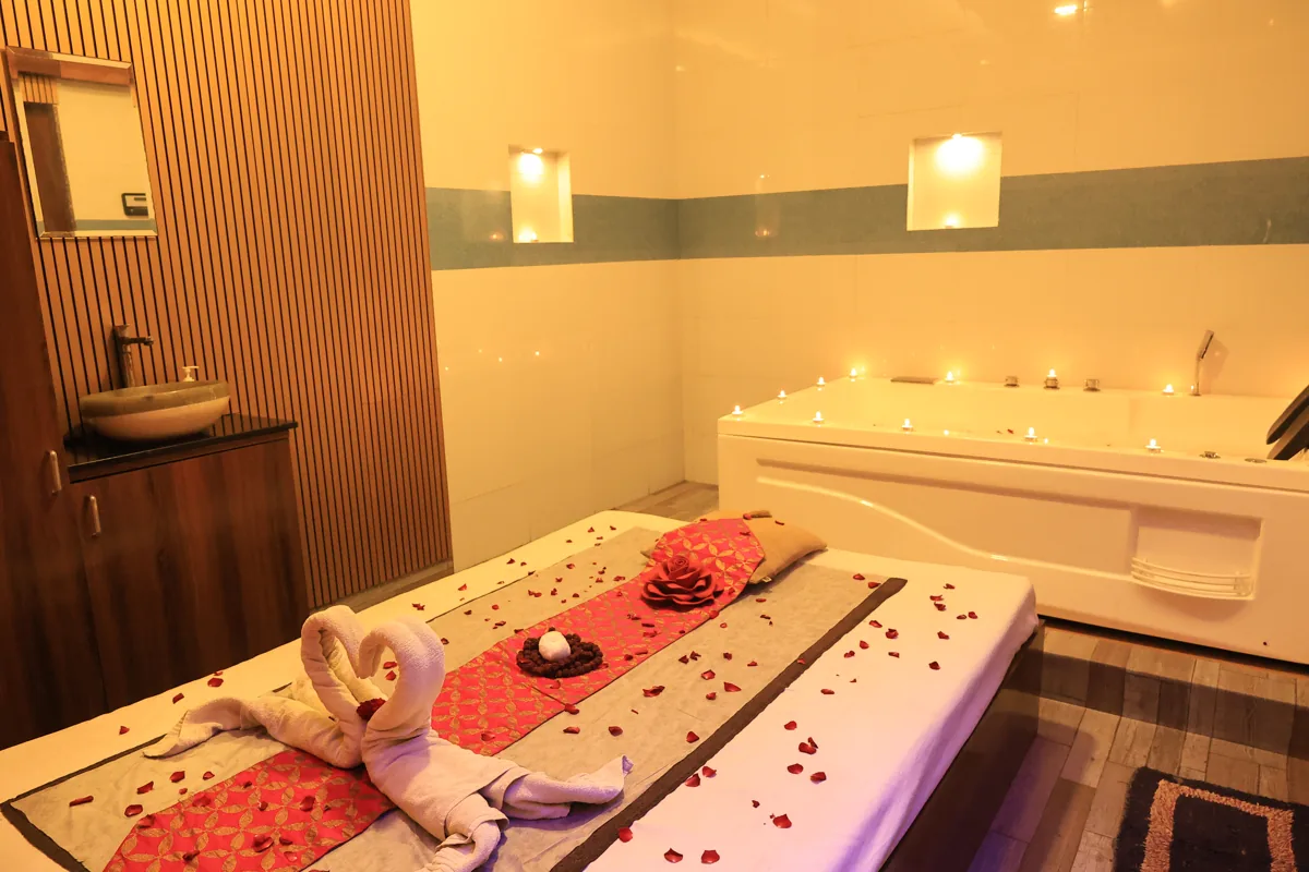 Massage room with jacuzzi and candlelight at Inara Spa, Mira Road East